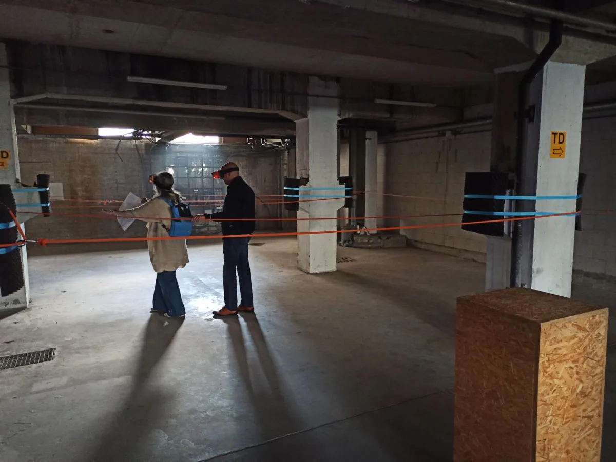 Two participants walking through the parkour to experience radar sensing through the Radar Vision goggles during the expo.