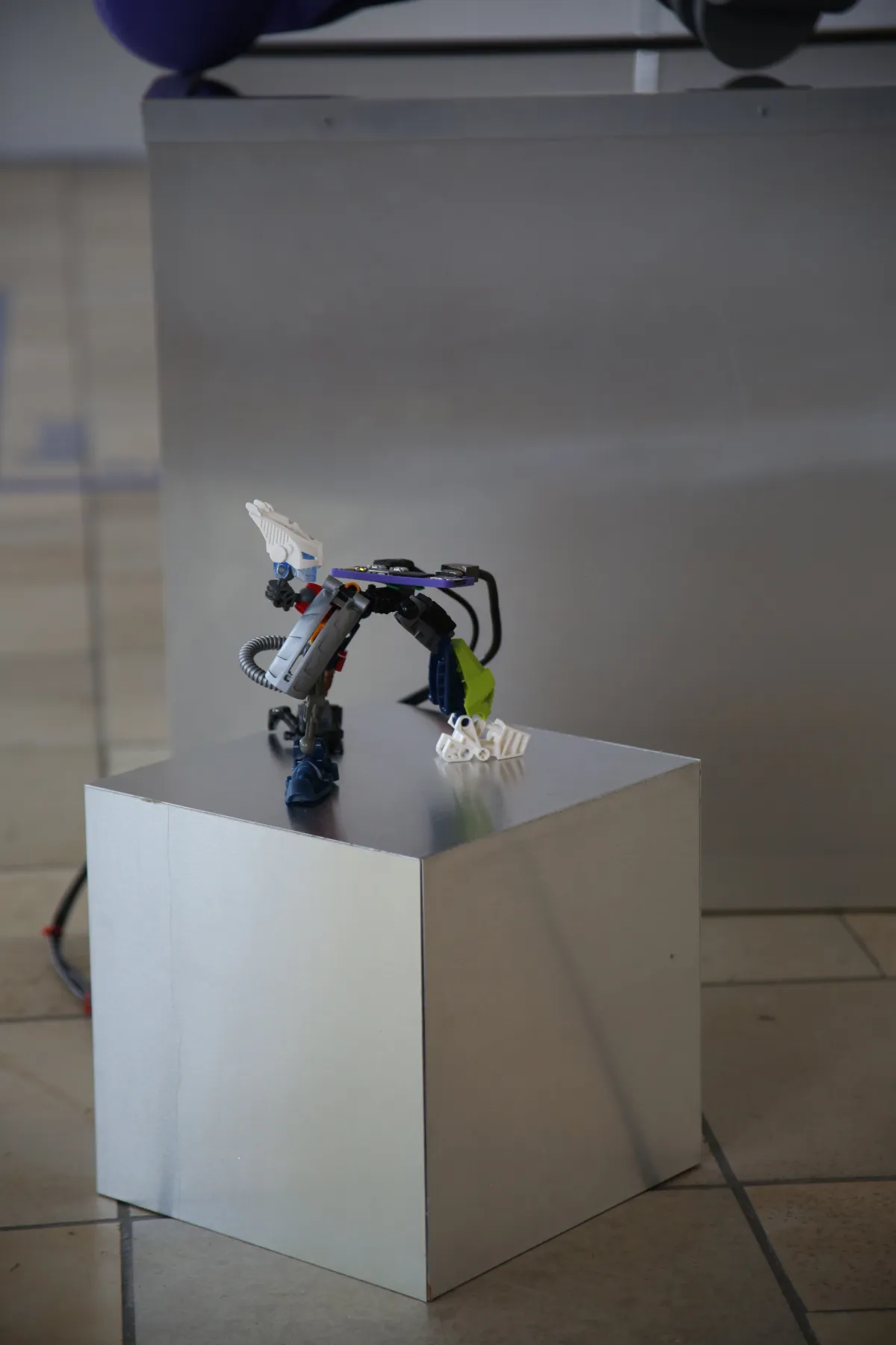 A detailed shot of a Bionicle collage with a custom 3D printed add-on to house a Raspberry Pi Zero 2 W (mini computer).